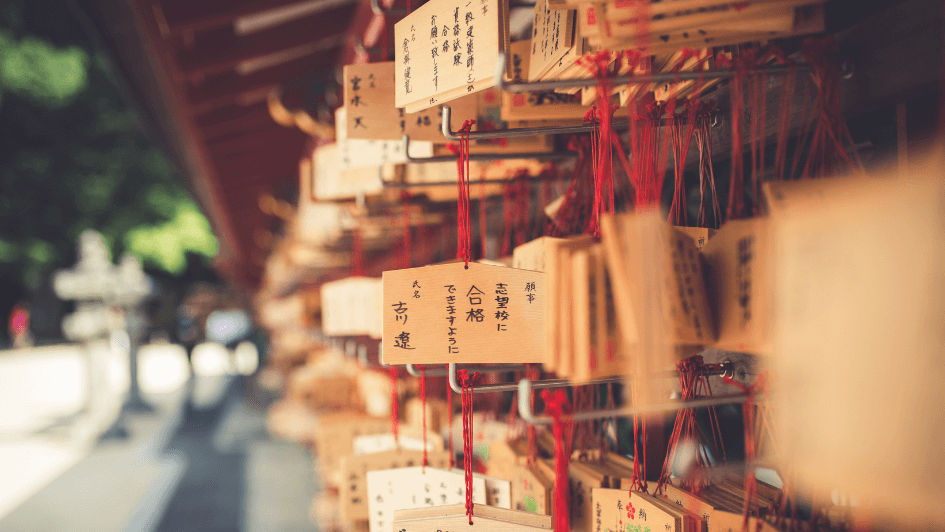japanese wooden ema blocks containing people's wishes for the new year